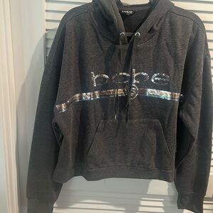 NWT BeBe Sweatshirt with Hoodie and with Sliver Sequin bling across the chest.